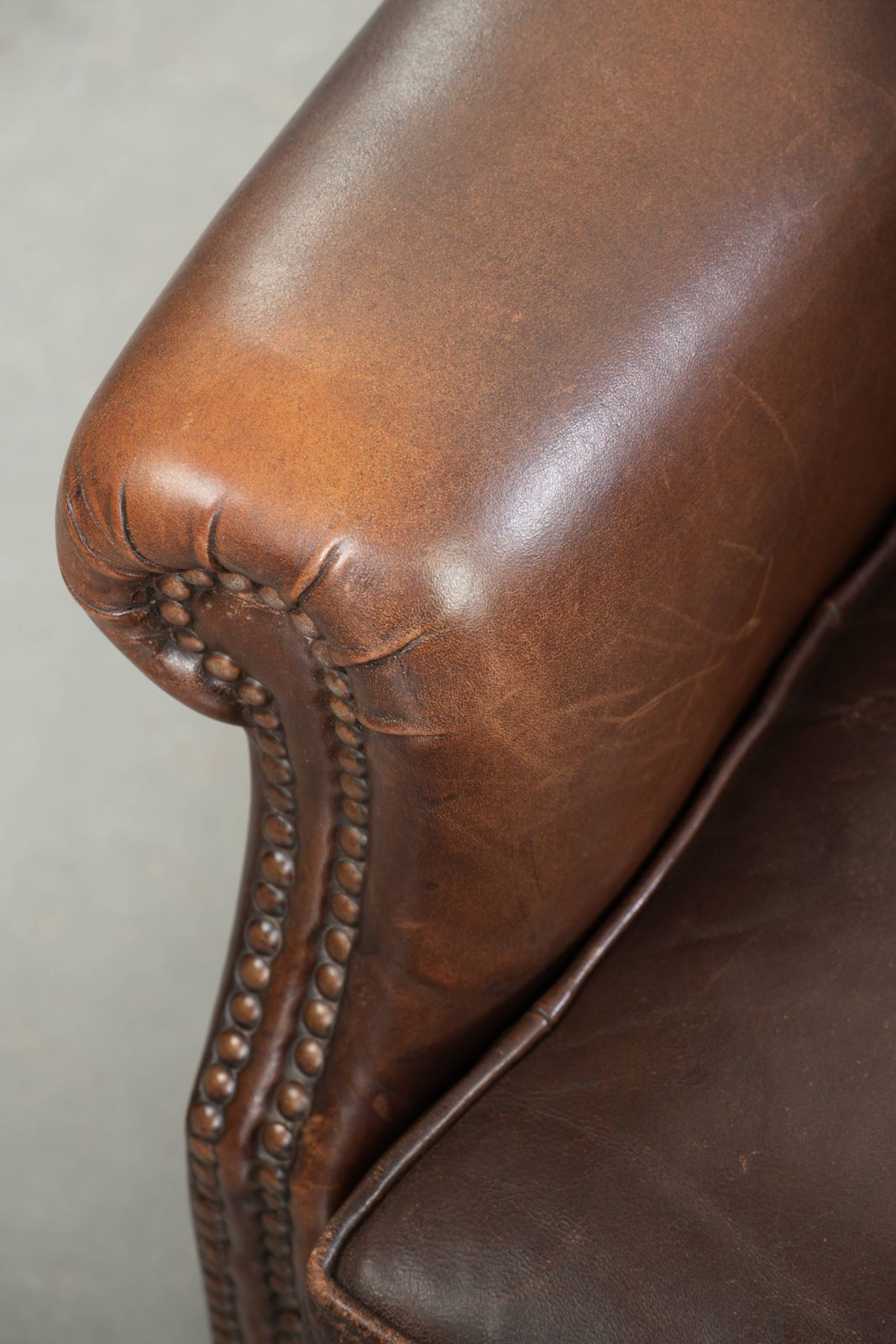Furniture Beautiful, Subtle Sheepskin Wing Armchair With A Deep Cognac Color And A Comfortable Seat. photo