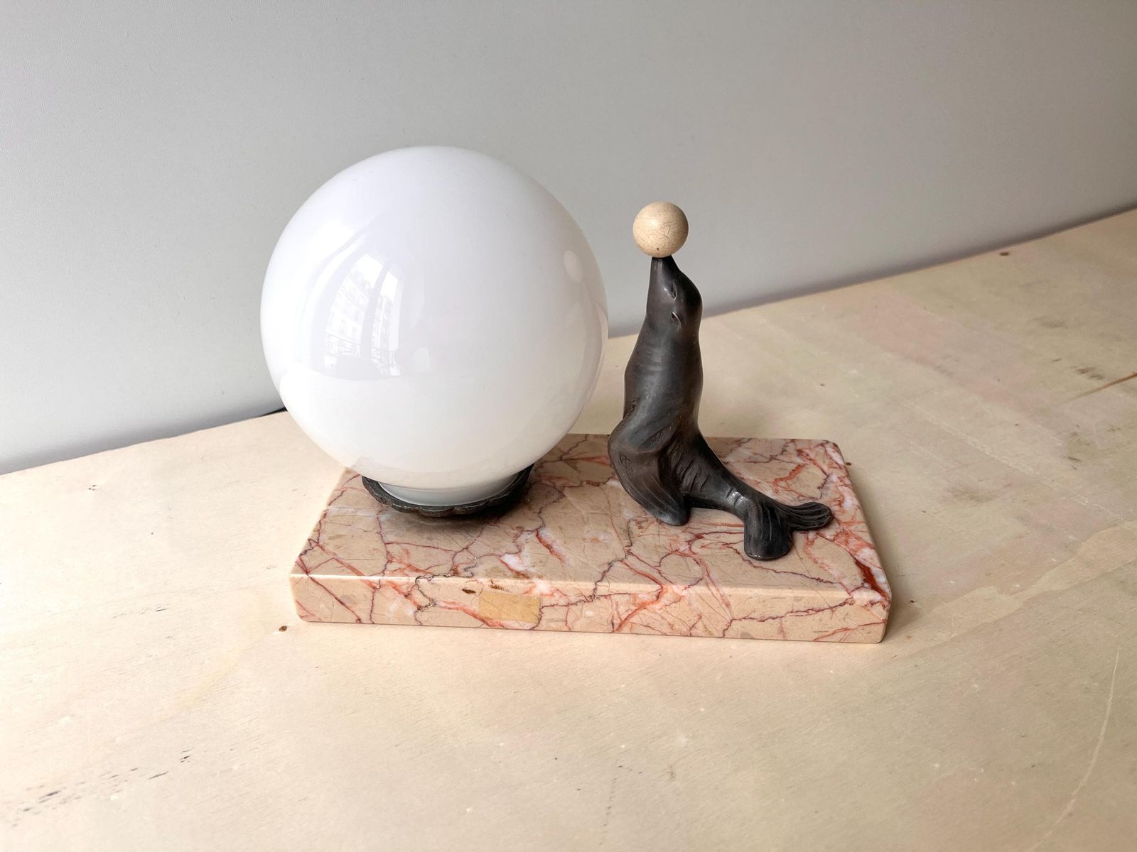 Antique Art Deco Table Lamp In Marble And Spelter, "The Sea Lion Playing With Balloon" 1930's Sphere Lighting photo for sale