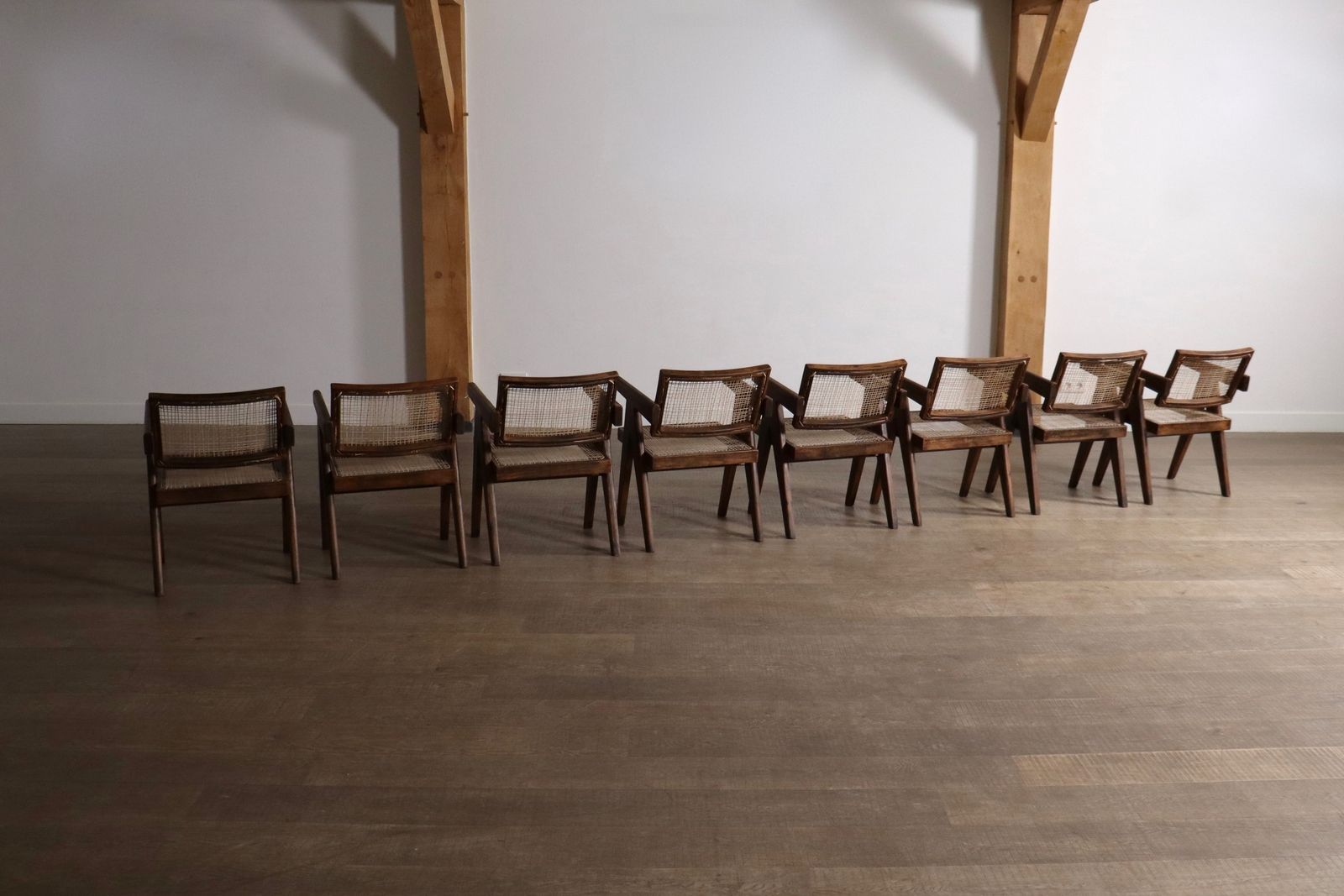 photo buy Set van 8 Pierre Jeanneret Office Cane Chairs, India ca. jaren 1950