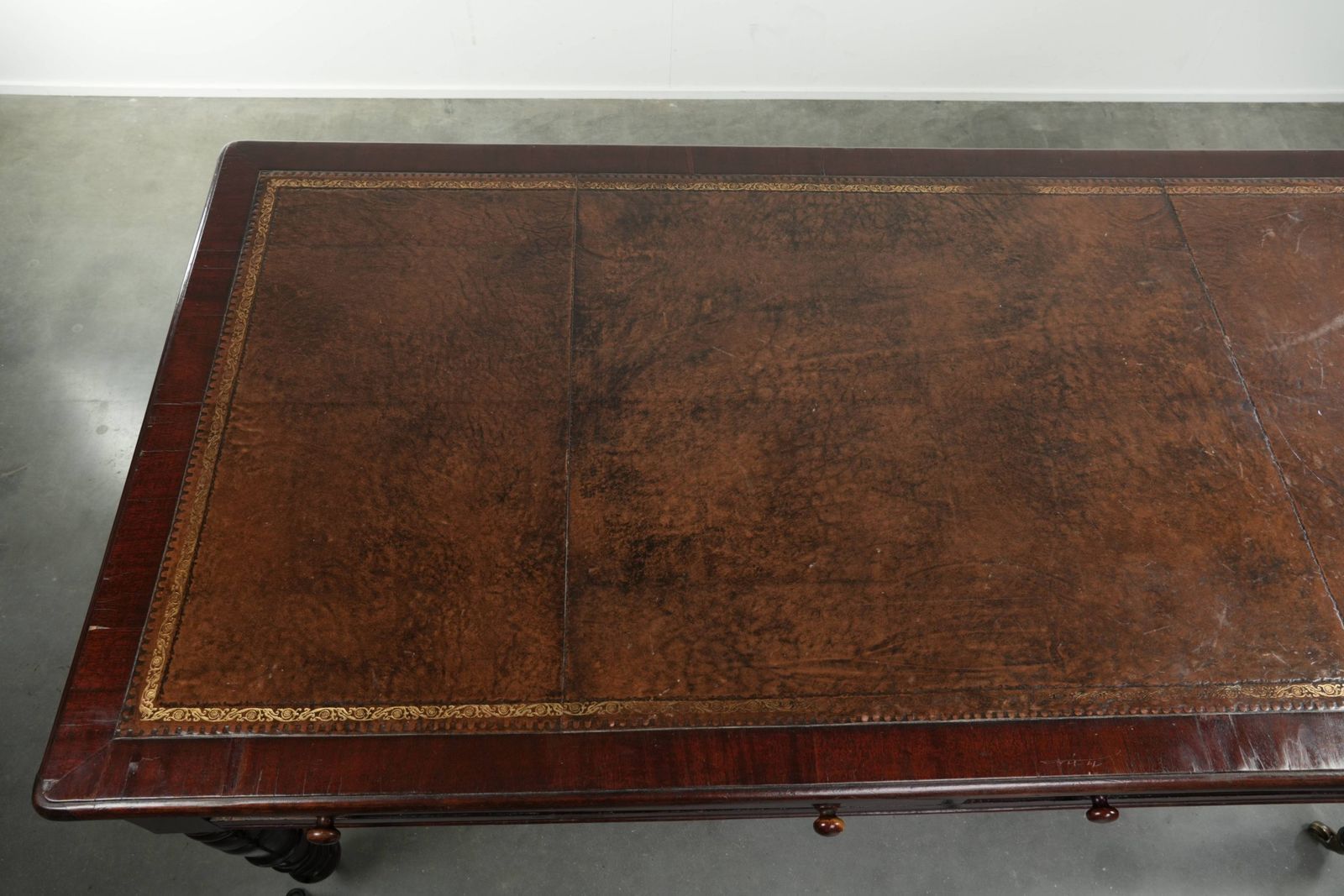 Antique English Writing Desk From The Late 19th Century With A Warm Wood Color And A Dark Brown Leather Top With Gold Accents. photo buy