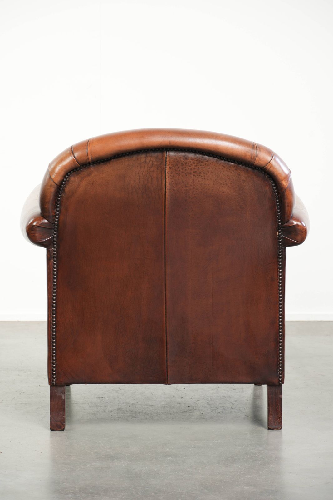 Vintage Sheep Leather Armchair With A Comfortable Seat And Finished With Ornamental Nails photo Furniture