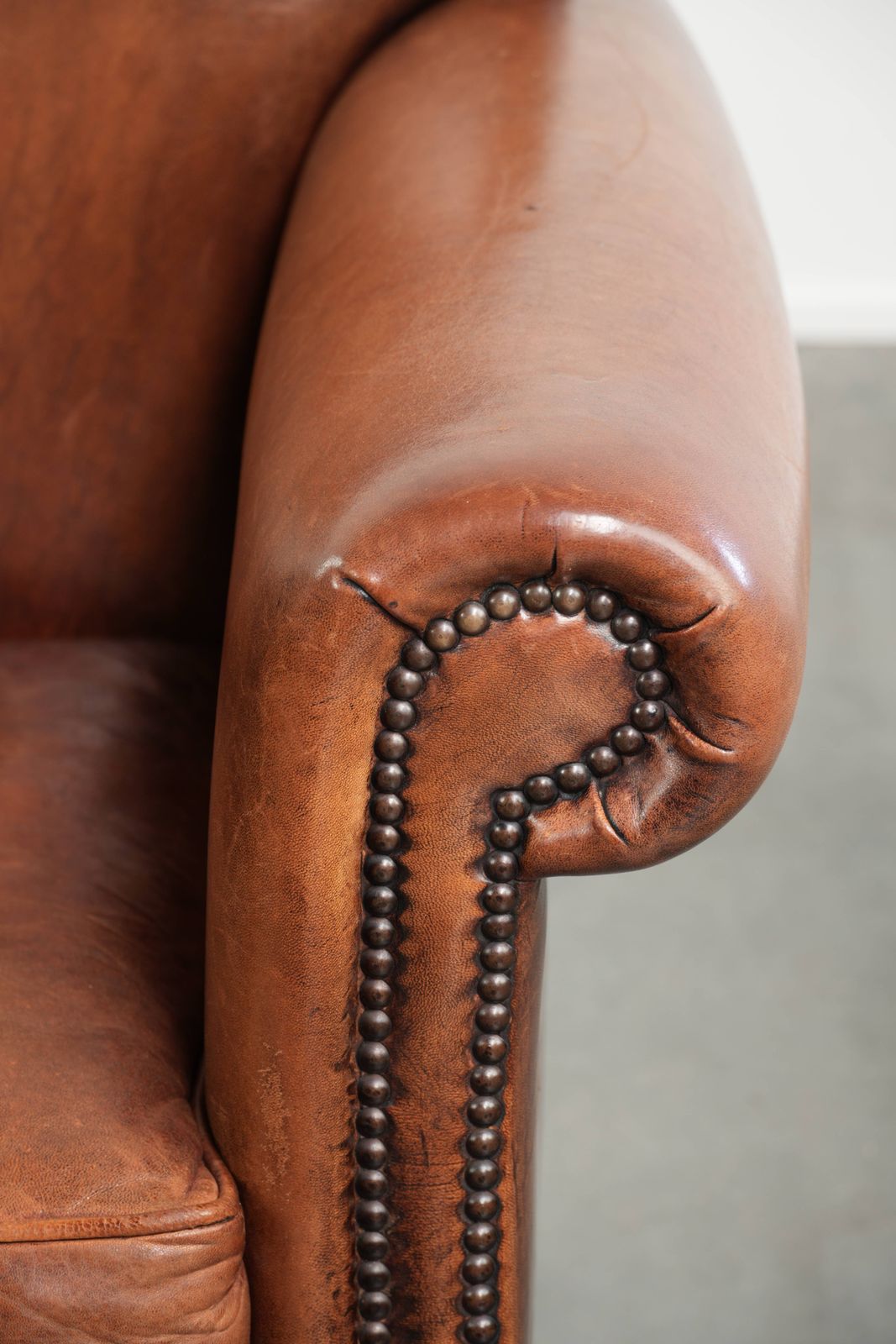 photo for sale Vintage Sheep Leather Armchair With A Comfortable Seat And Finished With Ornamental Nails
