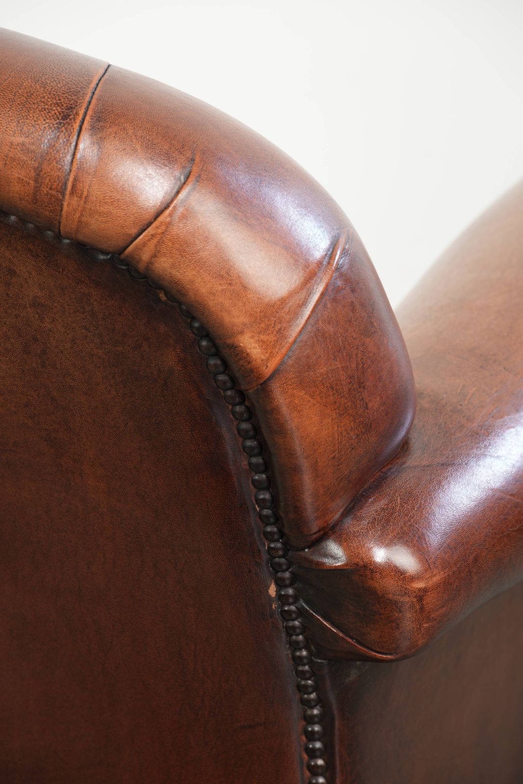 photo vinterior Vintage Sheep Leather Armchair With A Comfortable Seat And Finished With Ornamental Nails