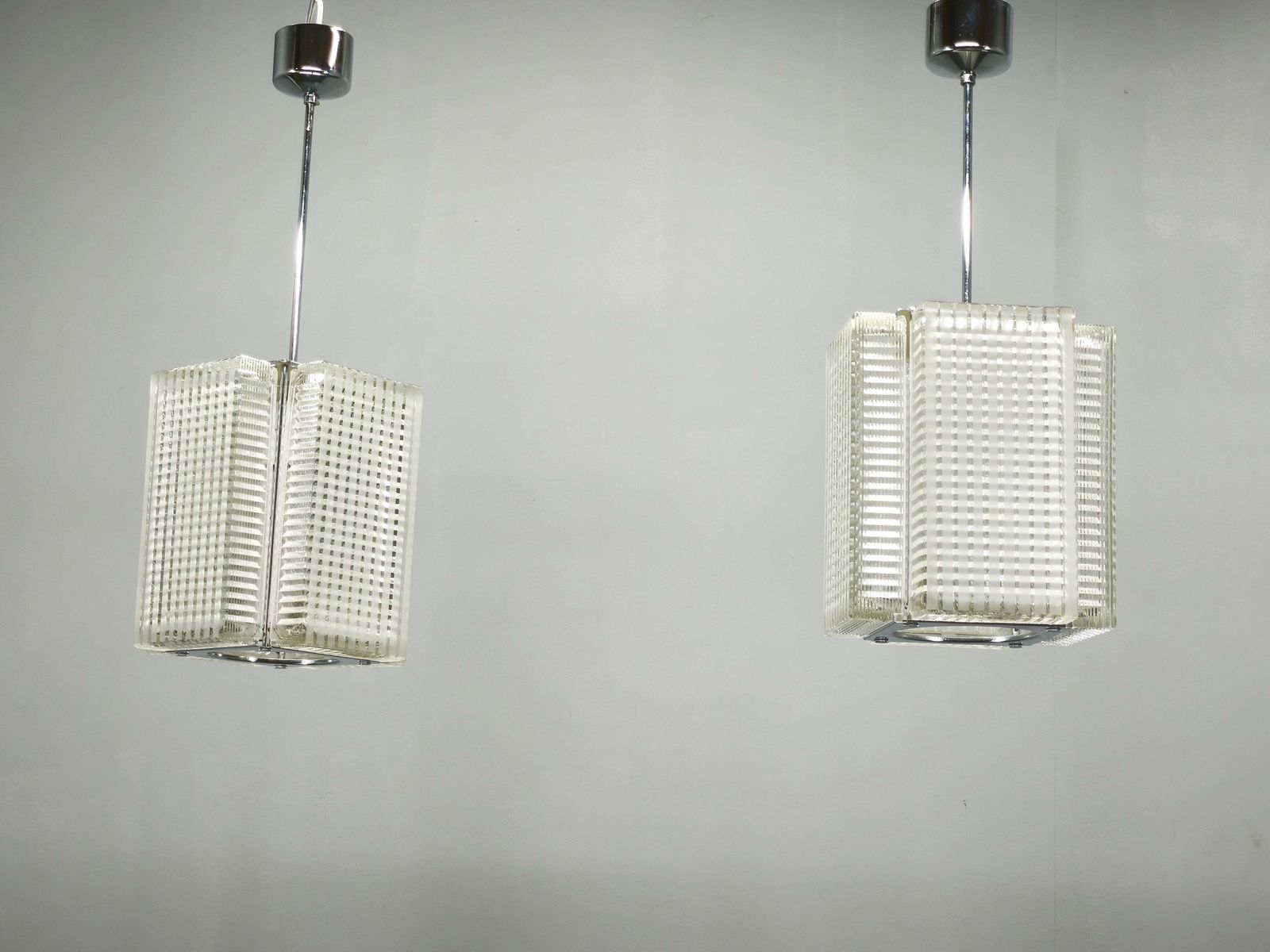Pair Of Napako Chrome And Textured Glass Pendant Lights, 1970s photo furniture