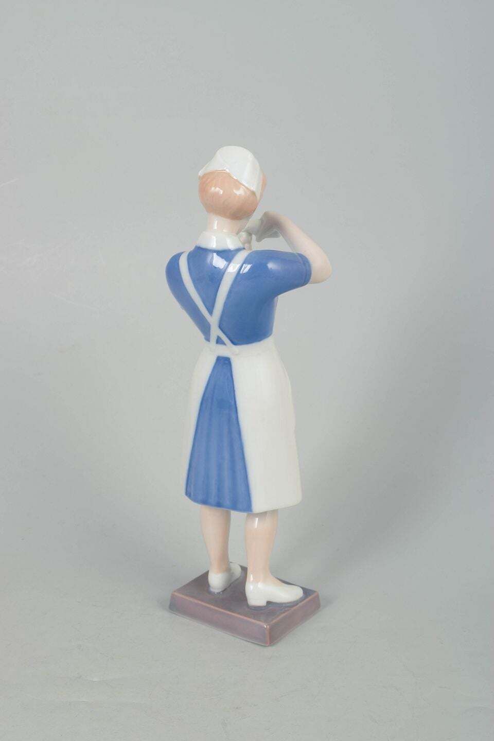 Bing & Grøndahl. Porcelain Figurine Of Nurse In Uniform. 1970s photo for sale