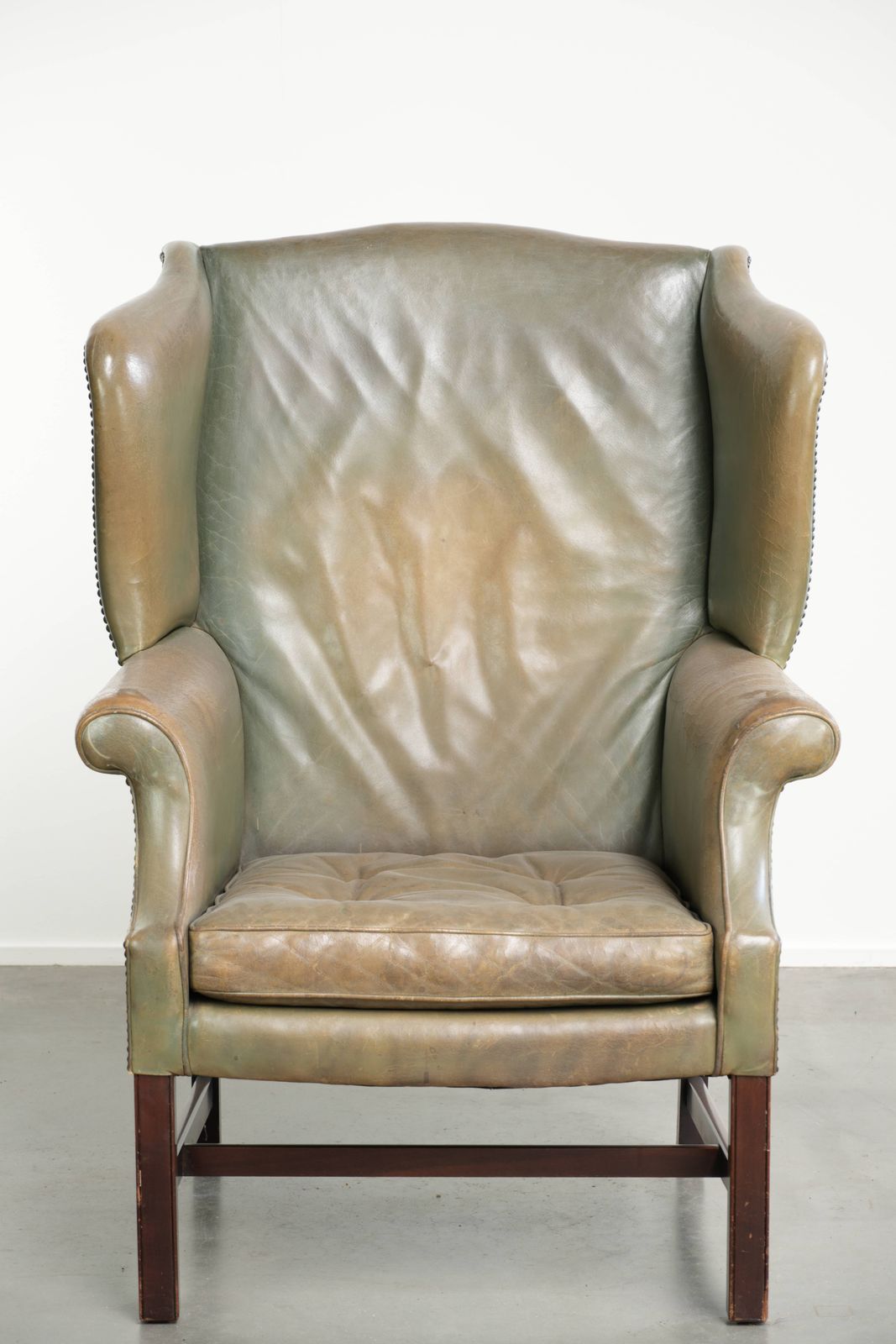 Old English Style Cowhide Wing Armchair With A Beautiful Patina And A Unique Color photo furniture