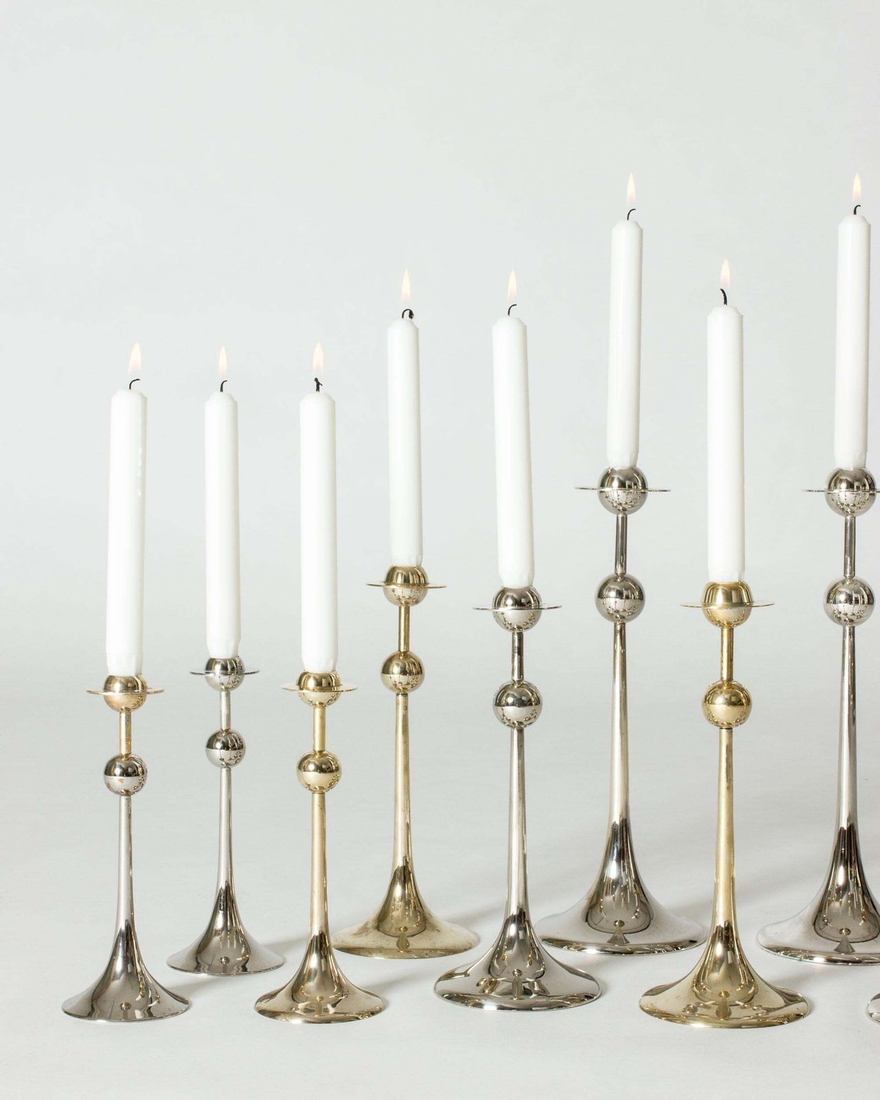 Midcentury Set Of 14 Silver Plated Candlesticks By Kjell Engman, Sweden, 1979 photo for sale