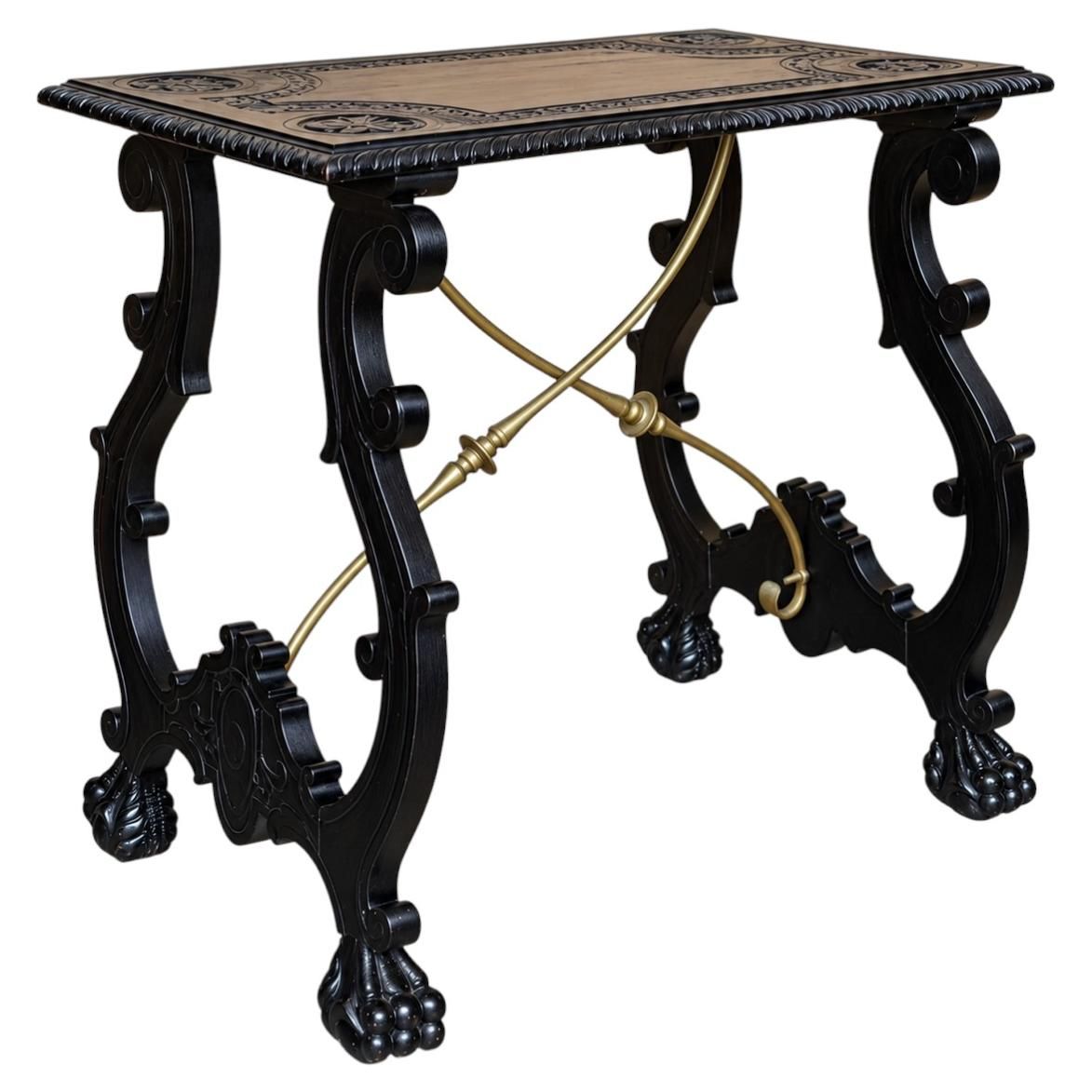 Antique Ebonized Carved Wood Center Table With Brass Stretchers And Paw Feet