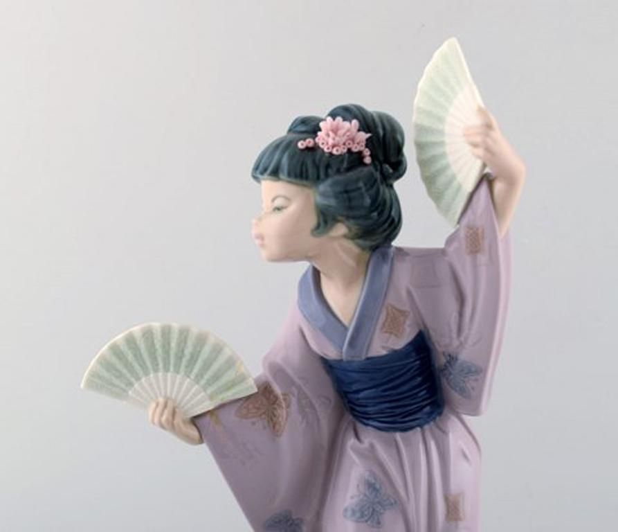 Lladro, Spain, Large Figure In Glazed Porcelain, Geisha With Fans, 20th Century photo for sale