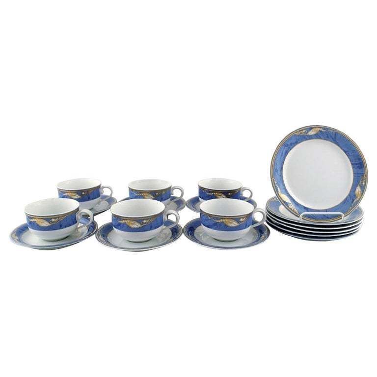 Royal Copenhagen, Set Of Six "Magnolia" Tea Cups With Saucers And Six Plates