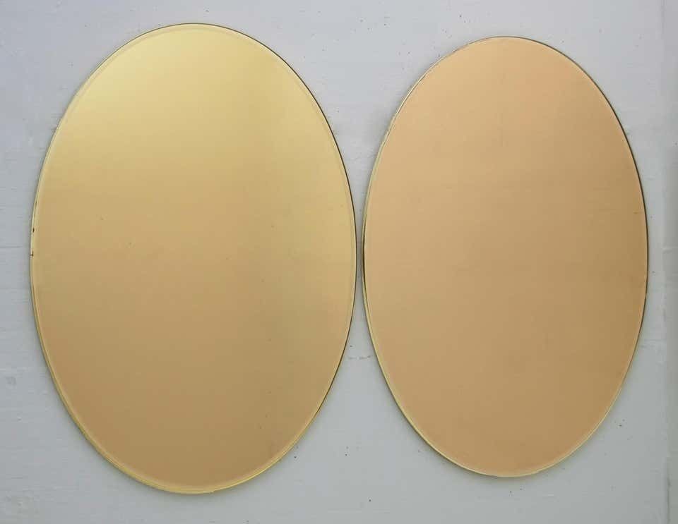photo furniture Pair Of Mid Century Modern Italian Oval Mirrors Brass And Bronzed Mirror, 1970s