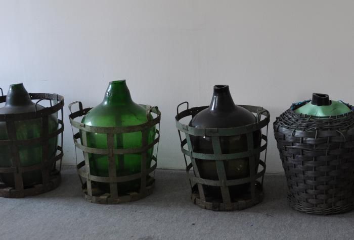 Glass Demijohn In Plastic Basket photo Home Decor