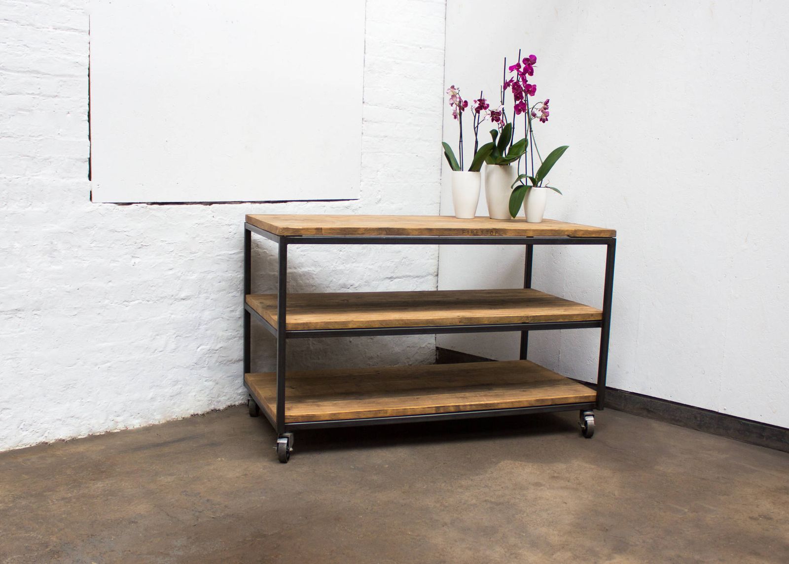 Charlie Bespoke Reclaimed Scaffolding Boards And Welded Dark Steel Box Section Framed Table With Shelves And Braked Vintage Castors photo for sale