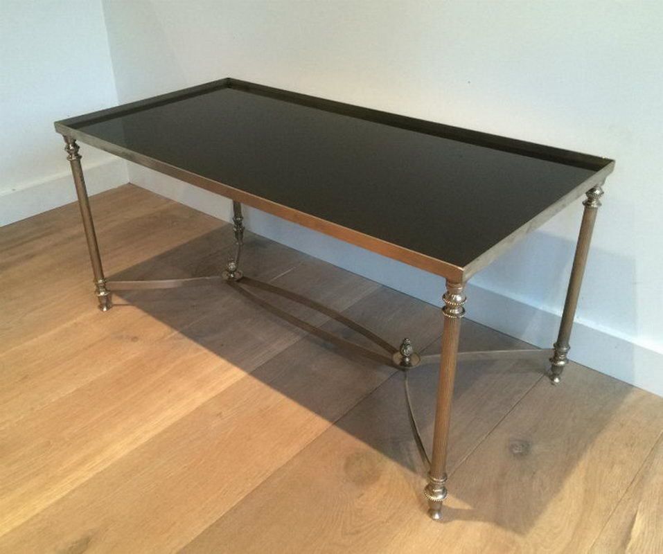 In The Style Of Maison Jansen. Silvered Coffee Table With Black Lacquered Glass Top. Circa 1940
