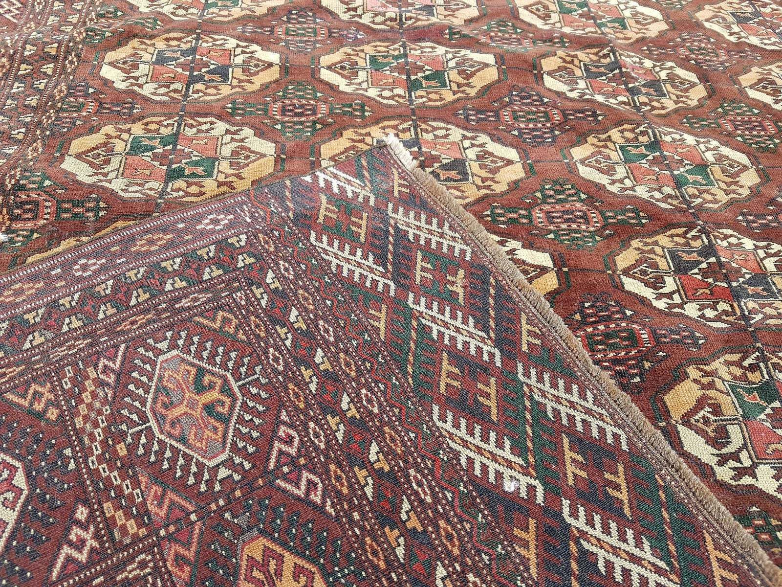 photo for sale 1950s Vintage Turkmen Wool Low Pile Tekke Bokhara Area Rug 8′7″ × 9′3″