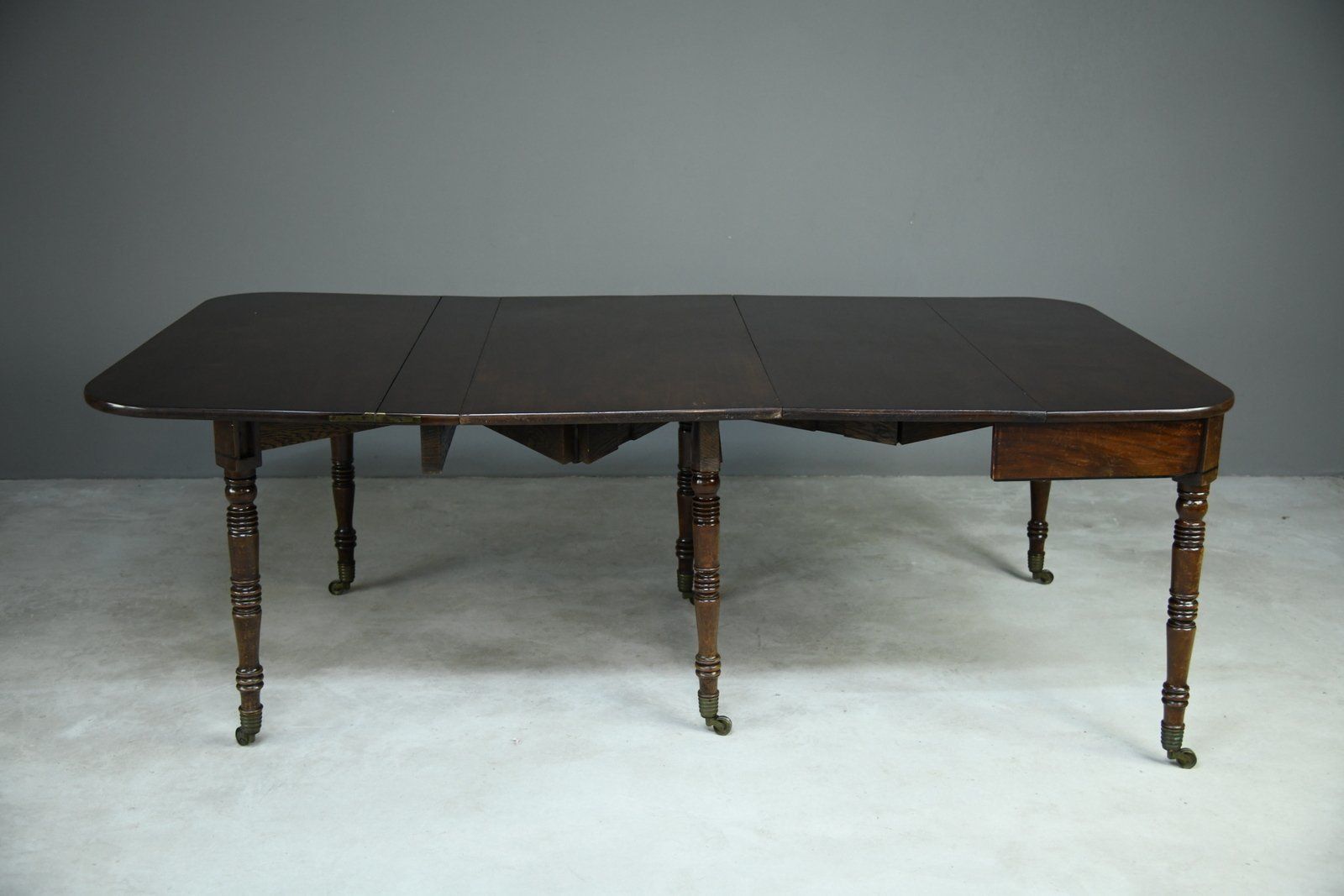 Antique Georgian Concertina Mahogany Dining Table. photo vintage