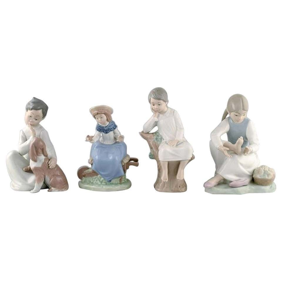 Lladro And Nao, Spain, Four Porcelain Figurines Of Children, 1980s 1990s photo furniture