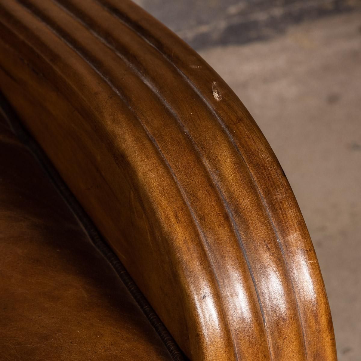 photo for sale 20th Century Art Deco Pair Of Leather Tub Chairs And Sofa, Circa 1920