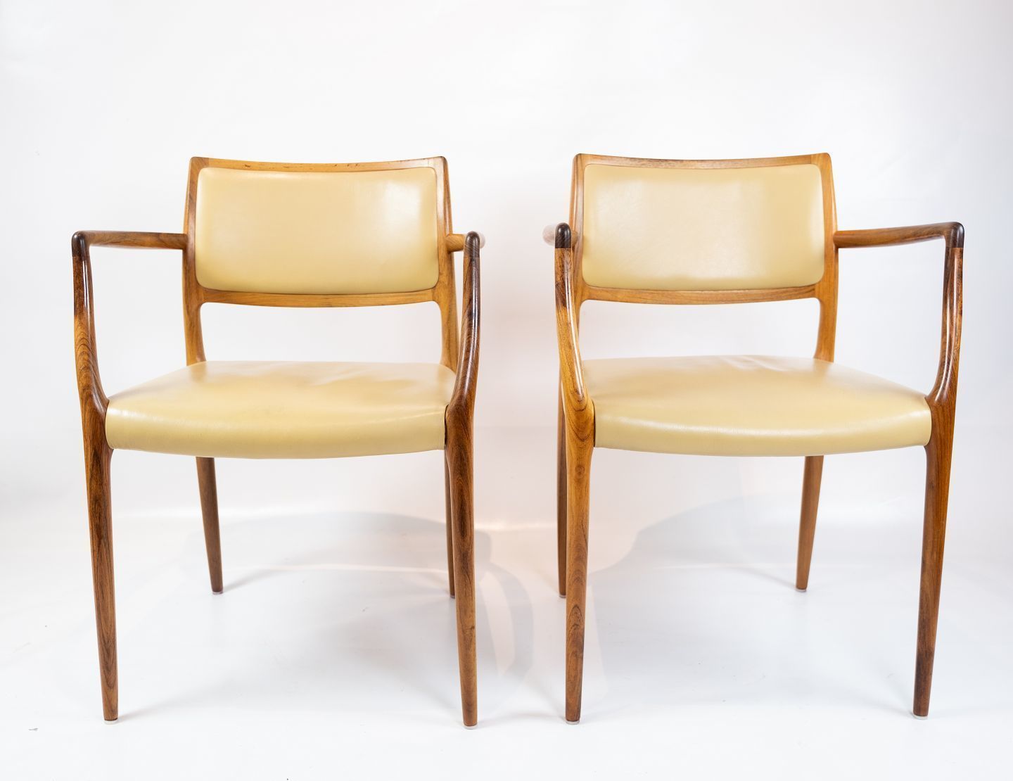 A Pair Of Armchairs, Model 65 Made In Rosewood  And Bright Leather By Niels O. Møller And J.L. Moller   1968
