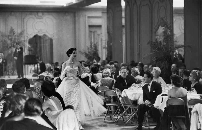 Slim Aarons 'Saks Fashion Show' 1955 Silver Gelatin Print Framed In White photo furniture