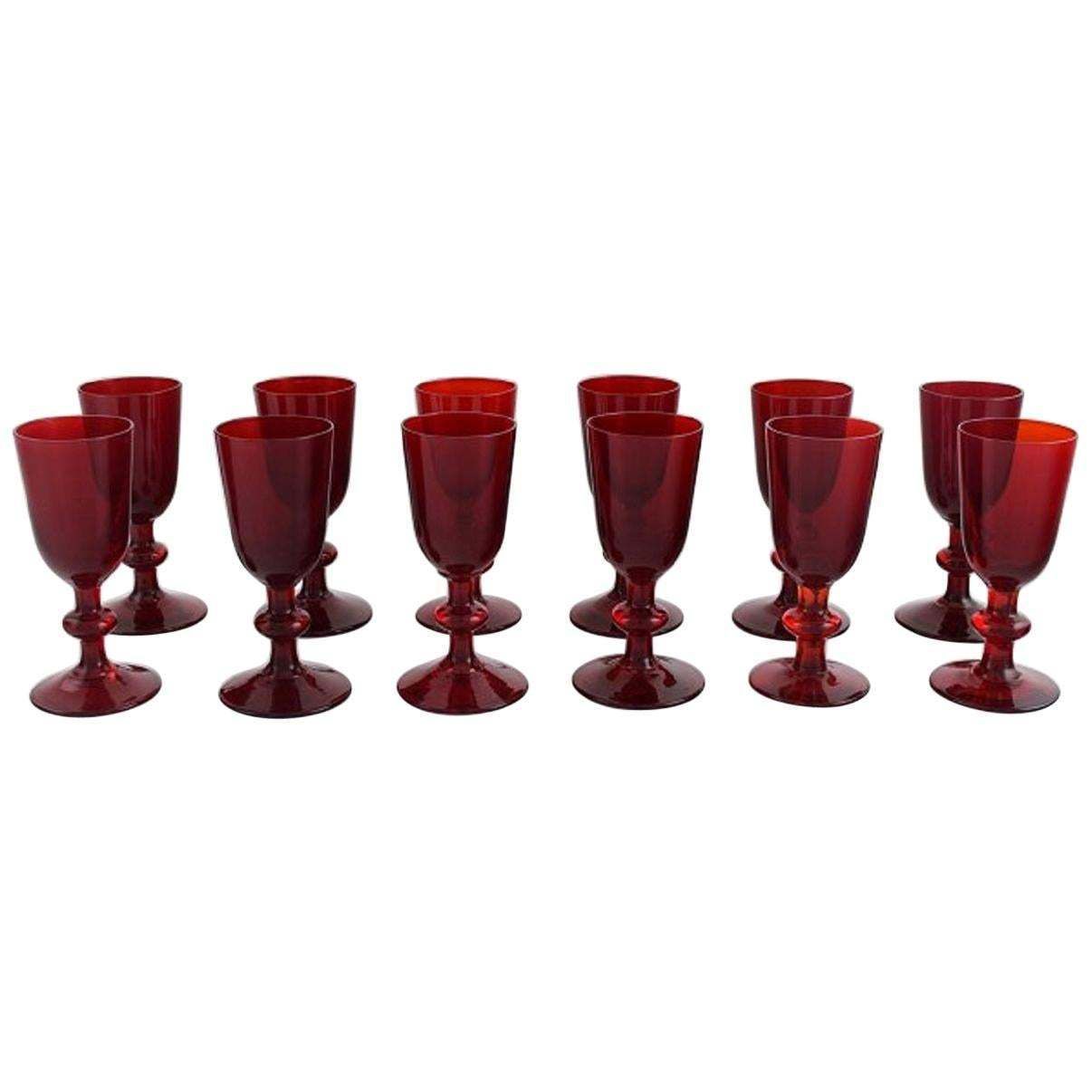 Monica Bratt For Reijmyre, Twelve Liqueur Glasses In Red Mouth Blown Art Glass