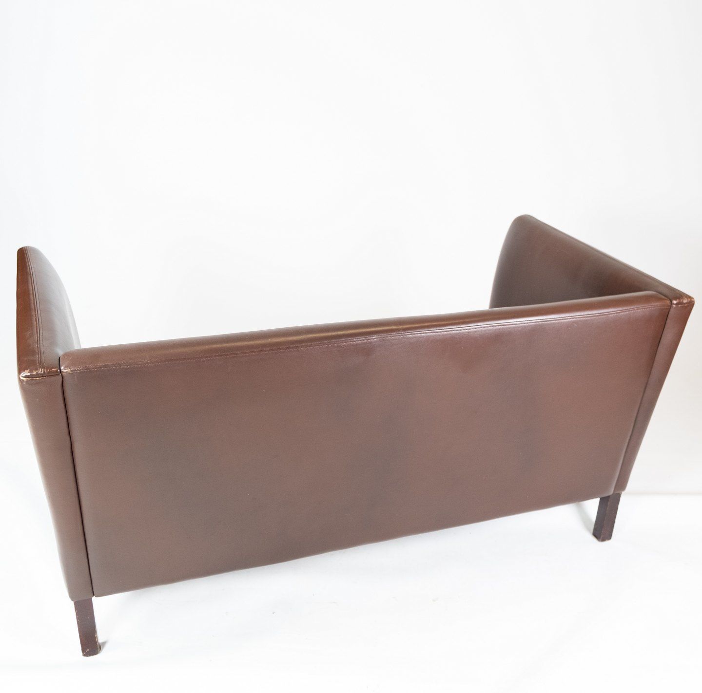 Two Person Sofa Upholstered With Dark Brown Leather Of Danish Design Made By Stouby Møbelfabrik From The 1960s. photo vintage