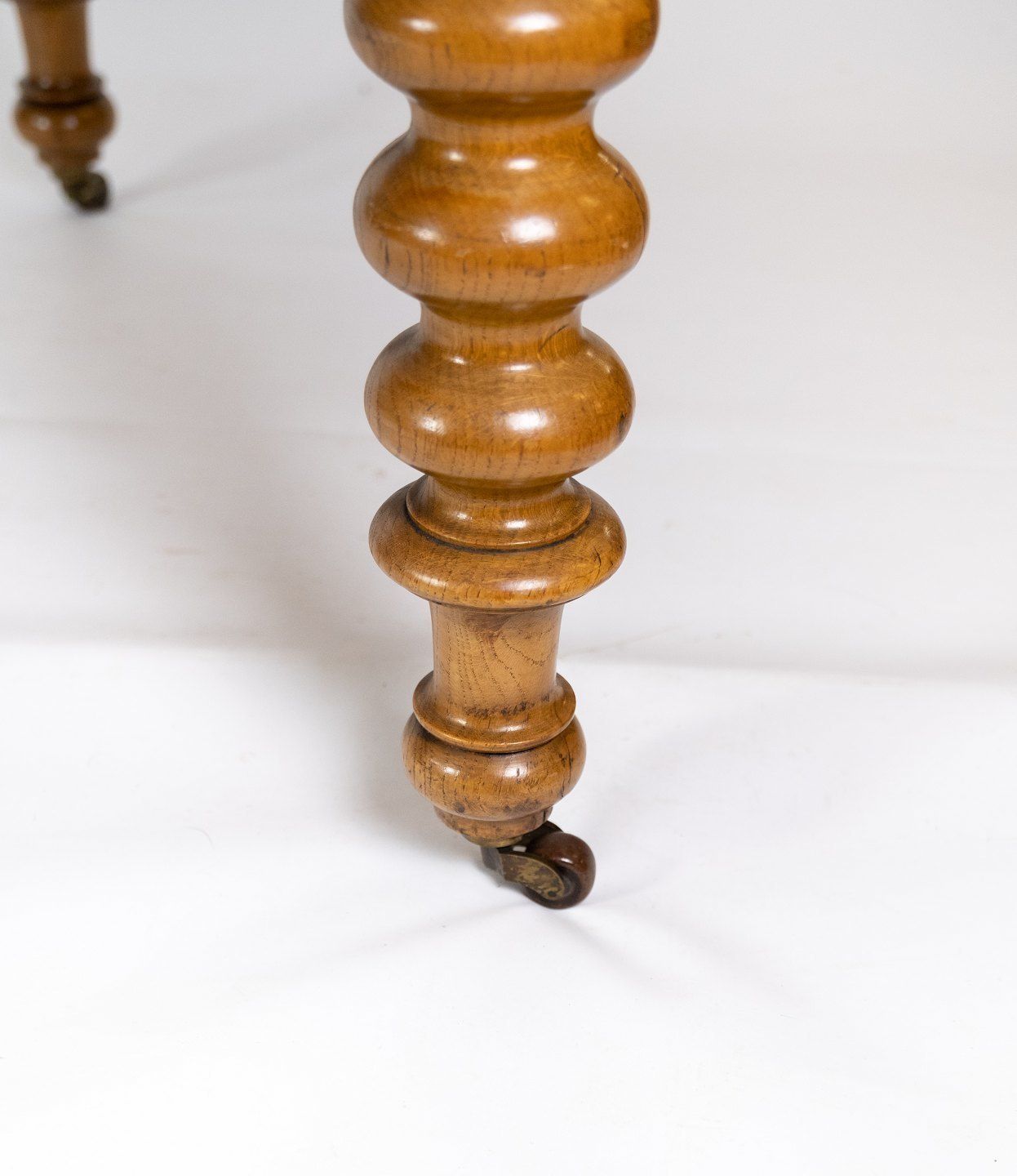 Large Dining Table Of Light Wood With Cutouts And Pull Out Plates From The 1920s. photo vinterior