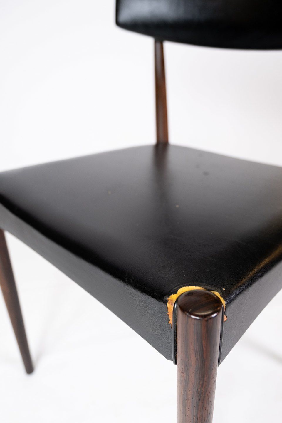 Set Of Four Dining Chairs In Rosewood And Black Leather Of Danish Design From The 1960s. photo for sale