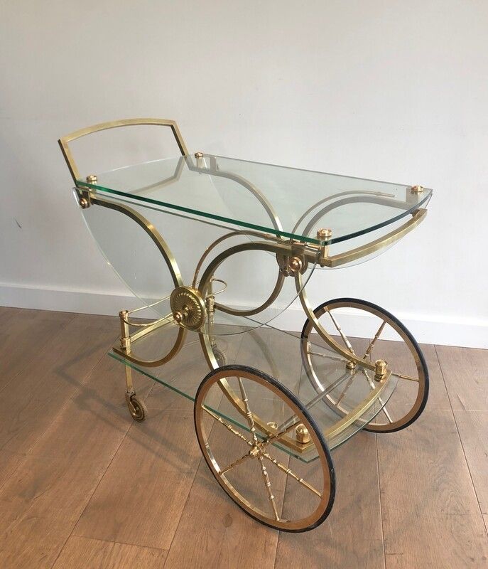 Maison Bagués. Rare Neoclassical Style Brass And Glass Drinks Trolley With Folding Rounded Glass Sides. French. Circa 1940 photo for sale