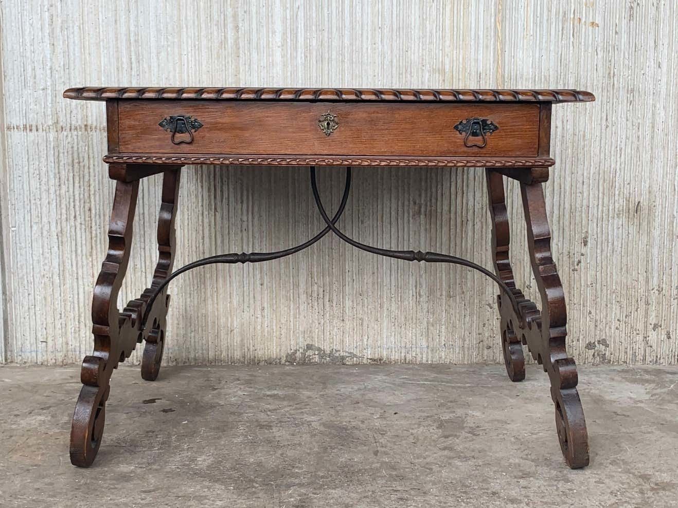 Early 20th Spanish Desk With Lyre Legs And Carved Edges On Top photo for sale