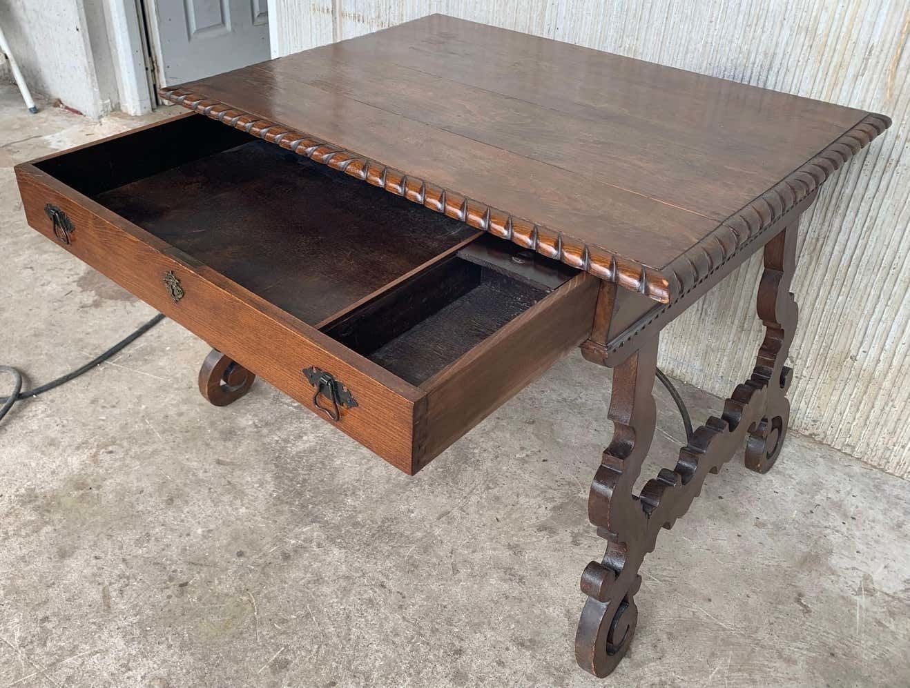 Early 20th Spanish Desk With Lyre Legs And Carved Edges On Top photo vinterior