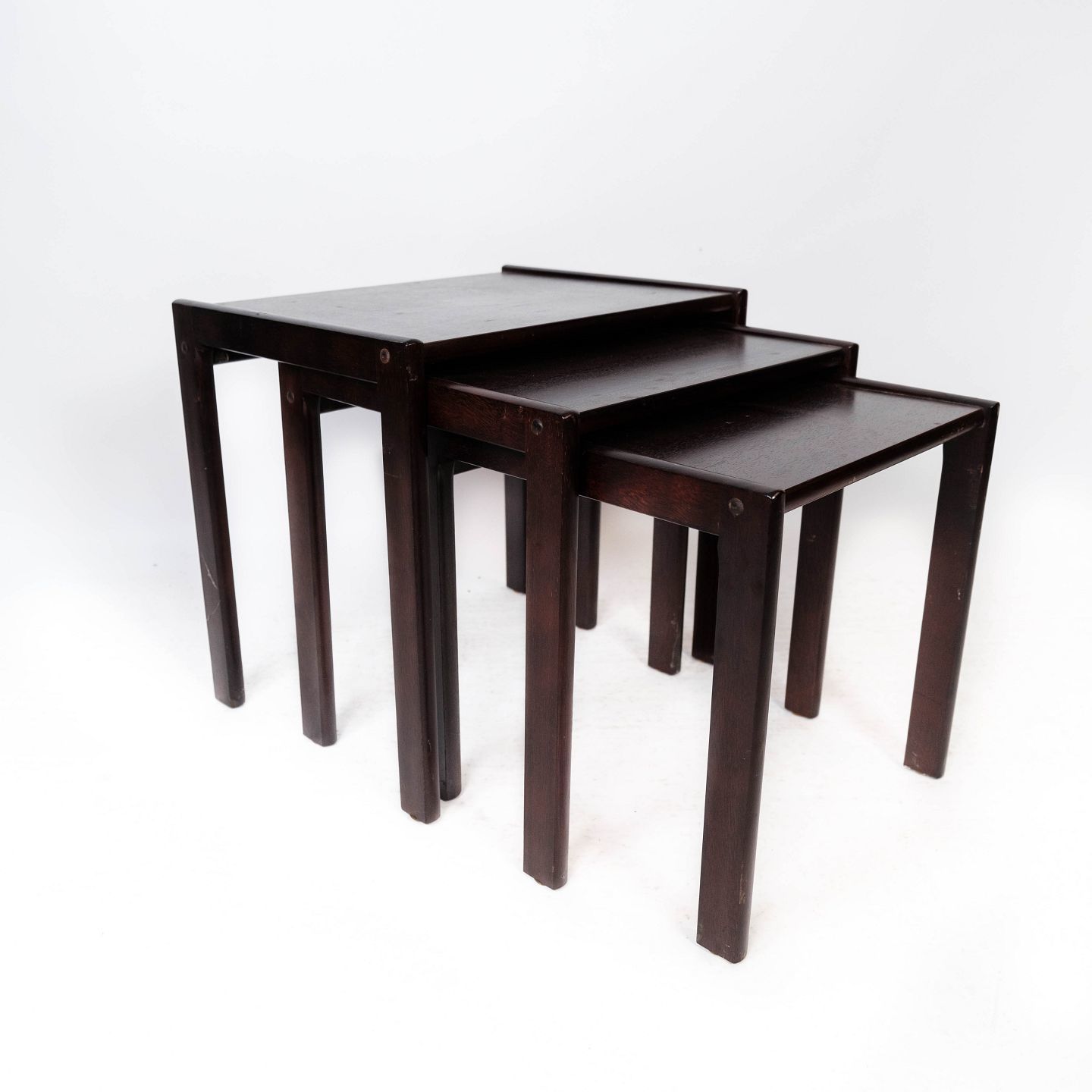 Set Of Insert Tables In Dark Wood Of Danish Design From The 1960s.