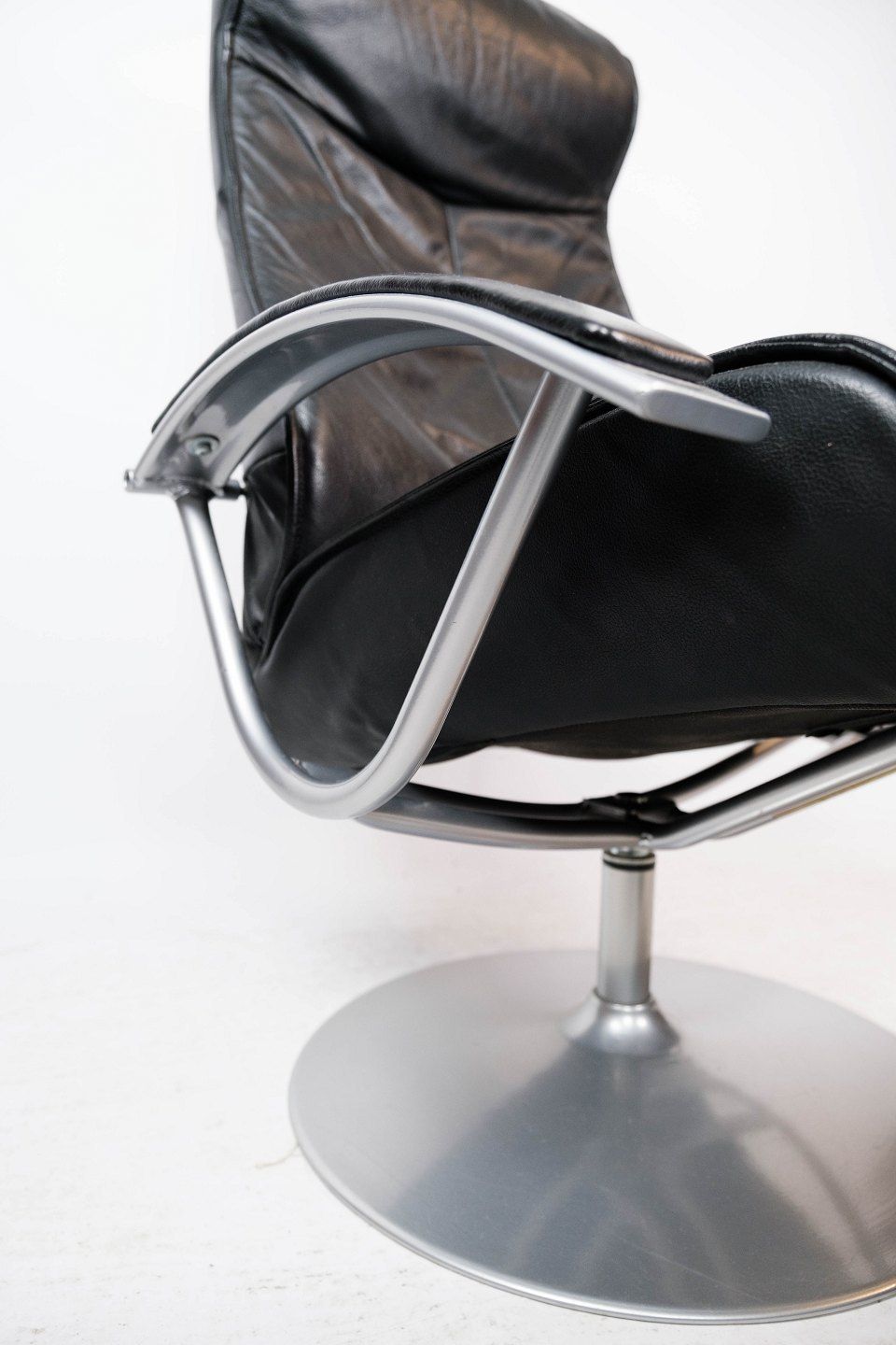 Armchair With Stool Upholstered In Black Leather And Metal Frame, By Danish Design From The 1970s. photo vintage