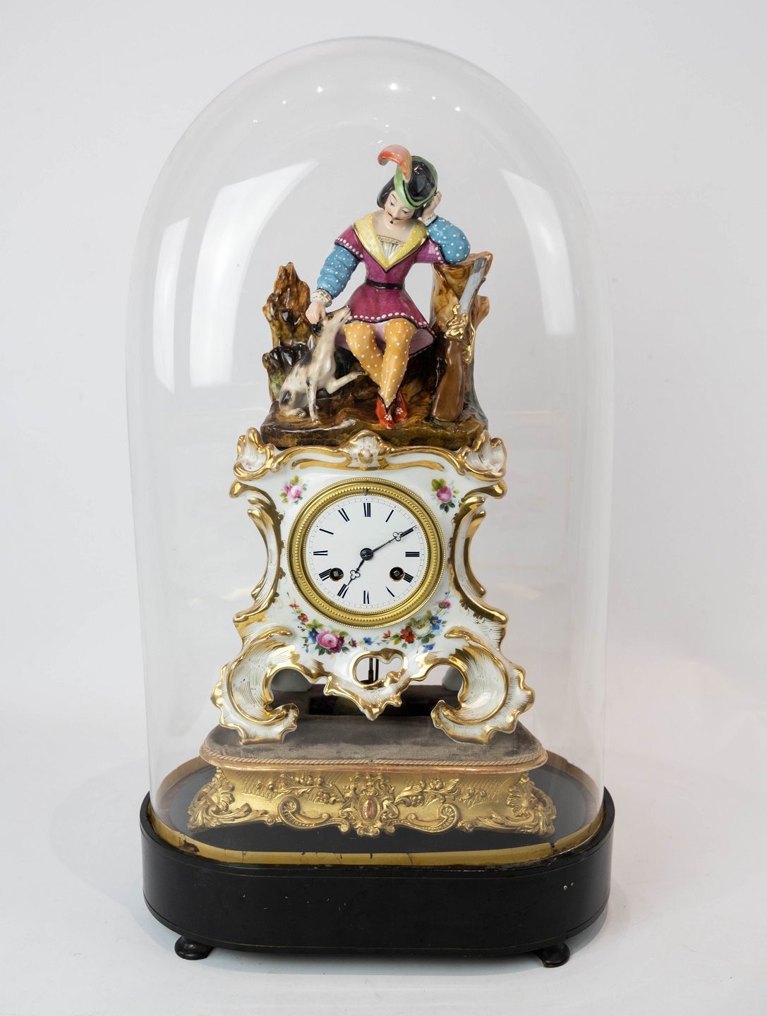 French Table Clock With Glass Dome And Decorated With Porcelain Figurine From 1860.