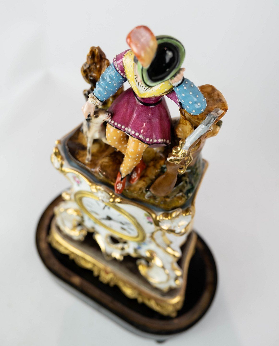 French Table Clock With Glass Dome And Decorated With Porcelain Figurine From 1860. photo furniture