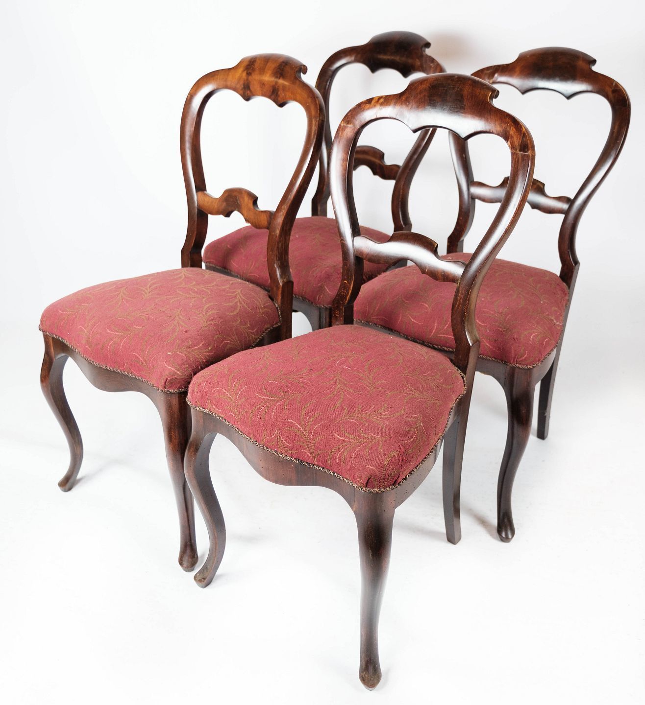 Set Of Four Mahogany Dining Chairs And Upholstered In Red Fabric From The 1860s.