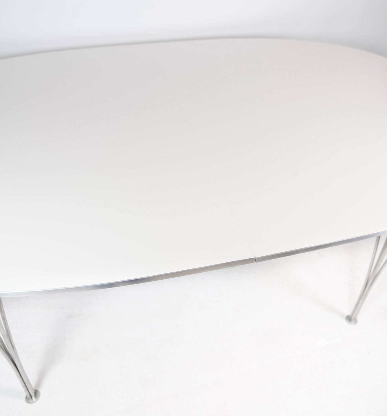 Super Ellipse Dining Table With White Laminate Designed By Piet Hein And Arne Jacobsen, And Manufactured By Fritz Hansen In 1998. photo for sale