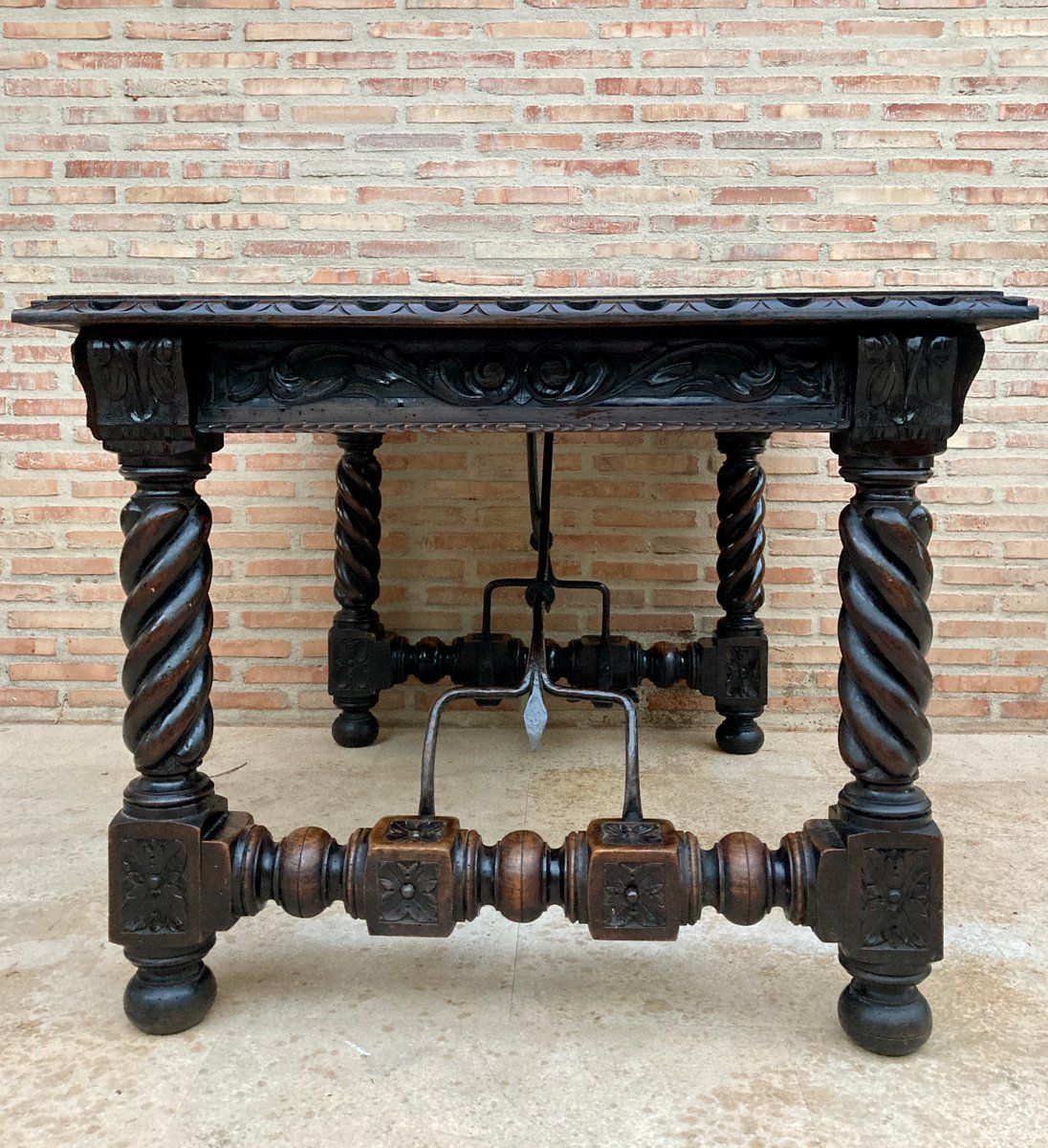 photo furniture Spanish Baroque Table With Dark Walnut Solomonic Legs With Carved Structure And Iron Stretcher