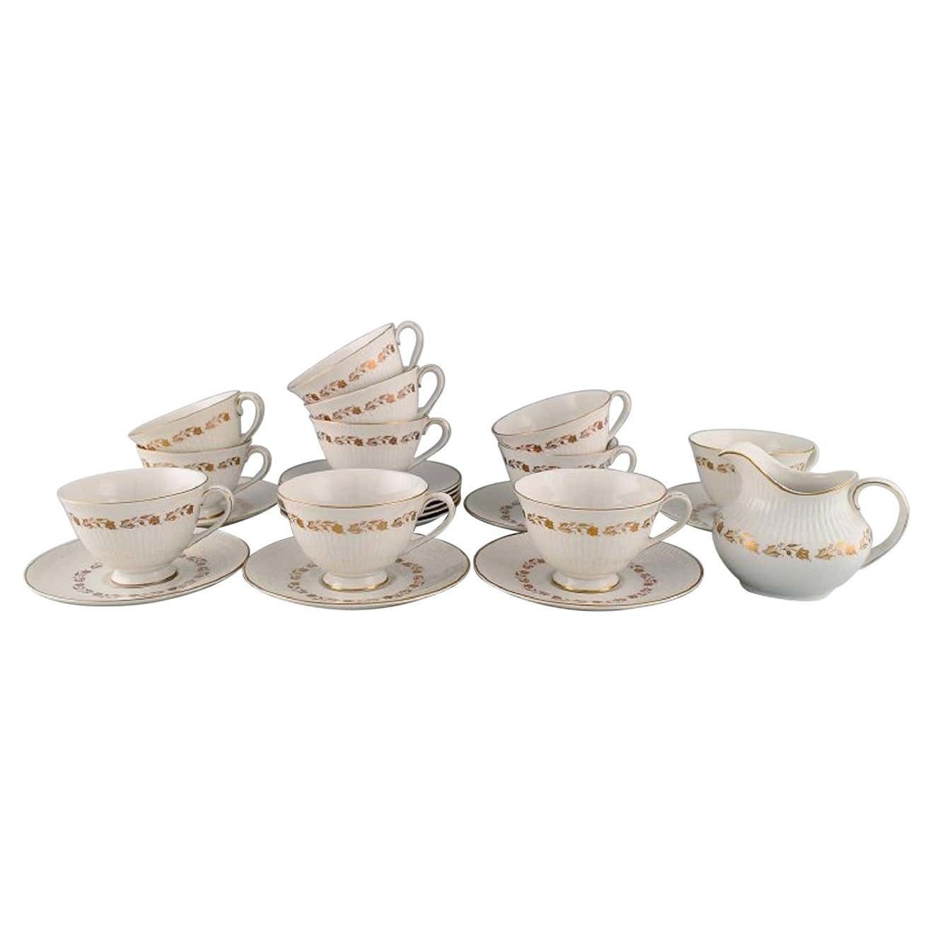 Royal Doulton, England, Twelve Fairfax Teacups With Saucers And A Cream Jug