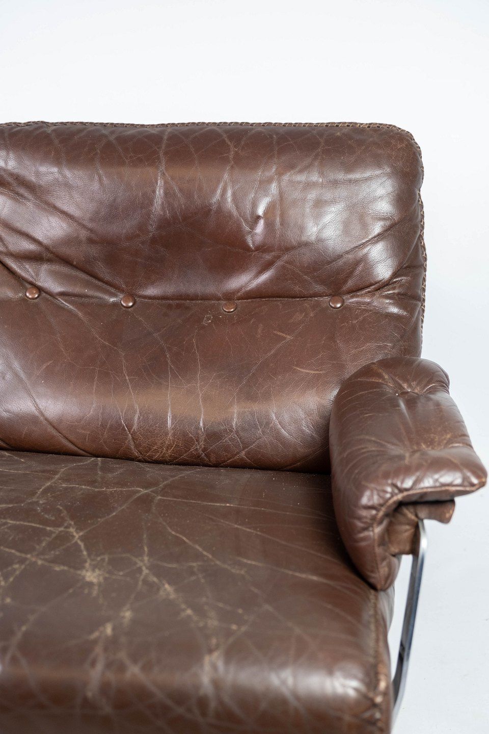 Two Seater Sofa In Brown Patinated Leather And Metal Frame, Designed By Arne Norell From The 1970s. photo vintage