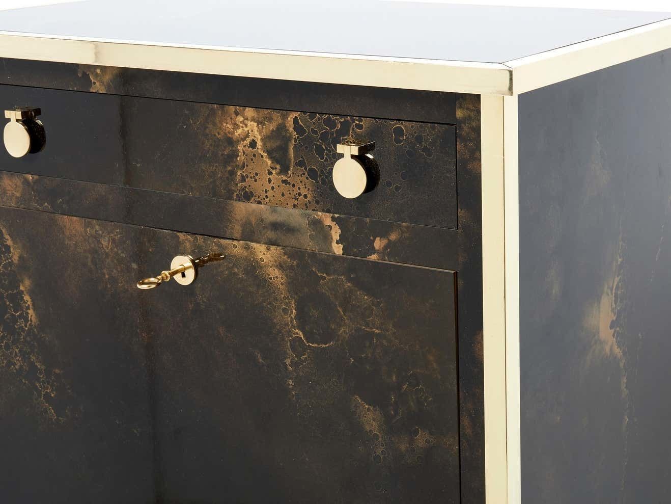 Secrétaire cabinet Maison Jansen en laque dorée et laiton, années 1970 photo for sale