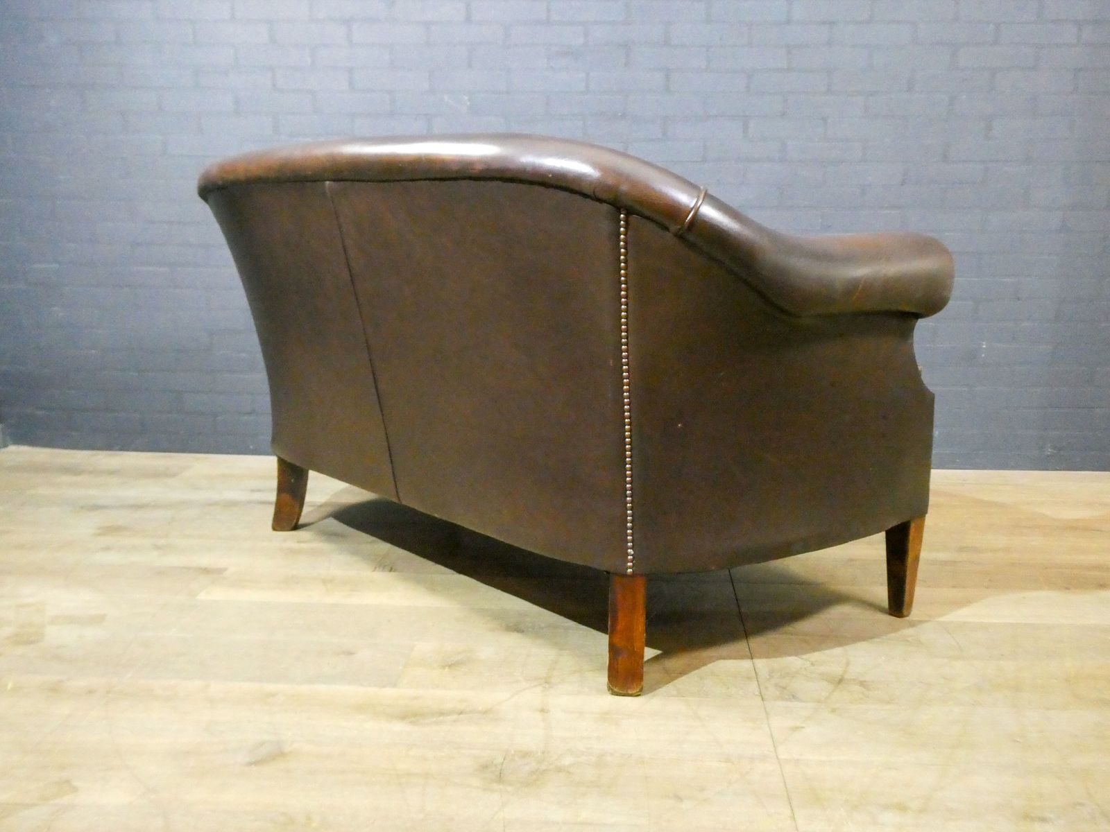 2 Seater Leather Sofa In Dark Brown photo vintage
