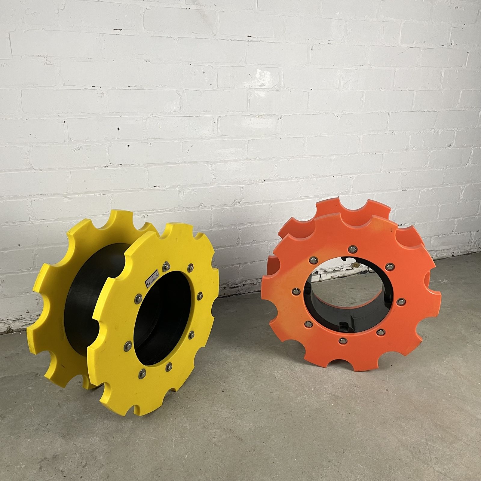 Two Reclaimed Industrial Plastic Machine Cogs photo for sale