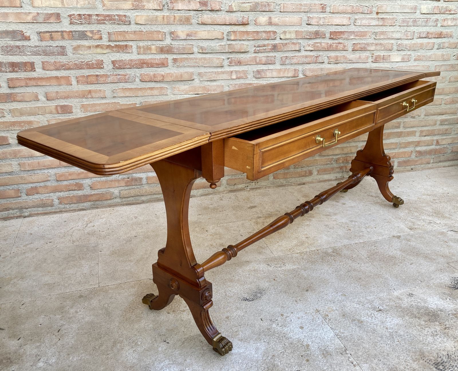photo furniture Mid 20th Century Winged Console Table In Walnut With Claw Feet In Bronze, Two Drawers And Wheels