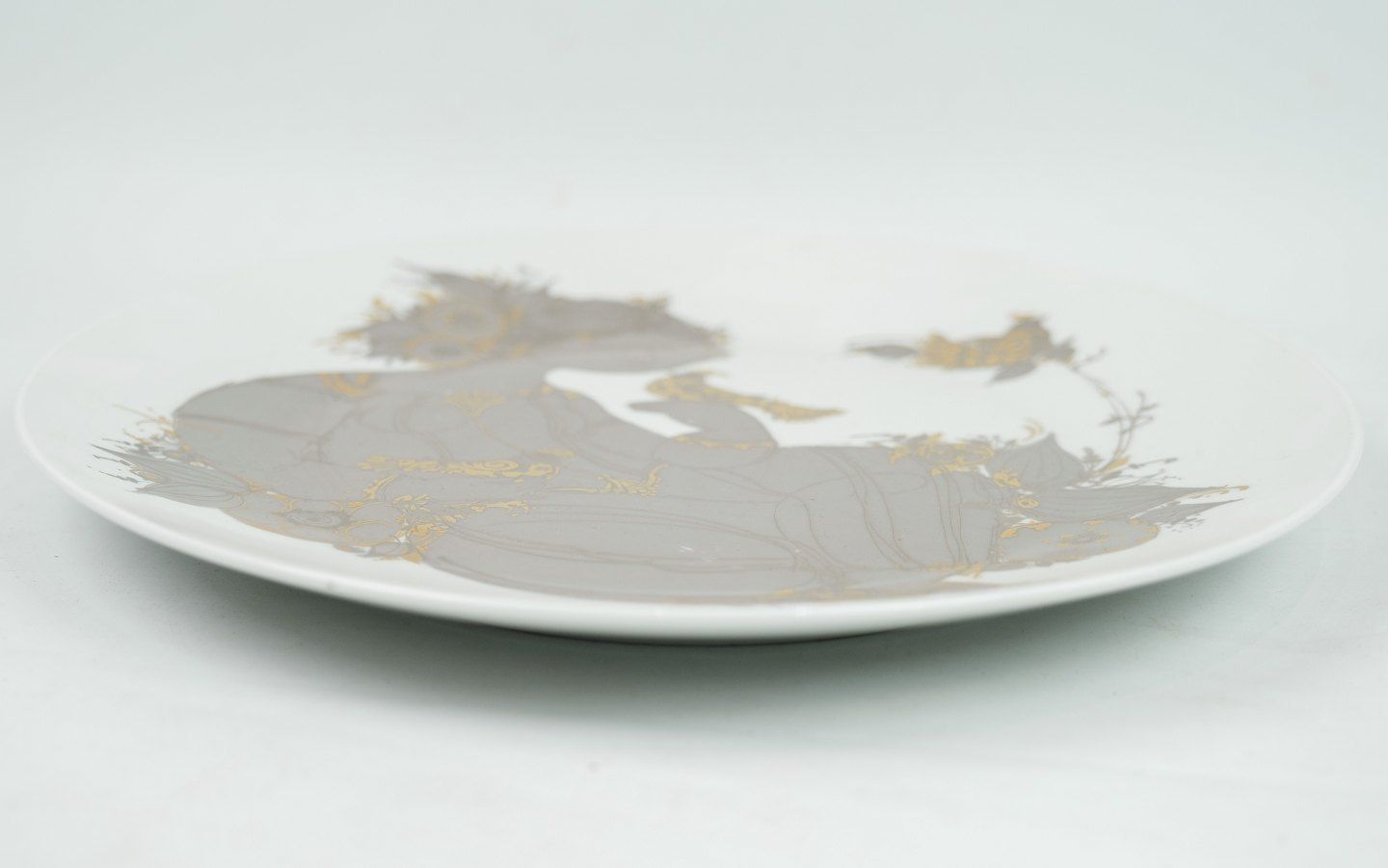 Plate With Motif Of Lady In Gold And Gray Colors In Porcelain Designed Bjørn Winnblad And Produced By Rosenthal. photo furniture