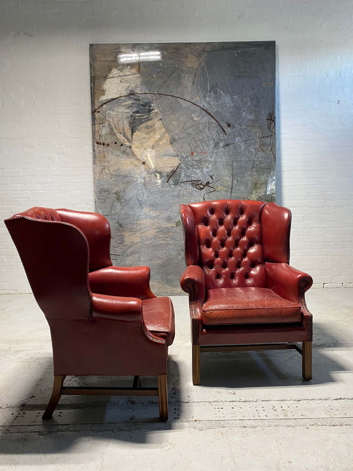 A Very Good Matching Pair Of Midc Gentleman’s Wing Chairs In Raspberry Leather photo Furniture
