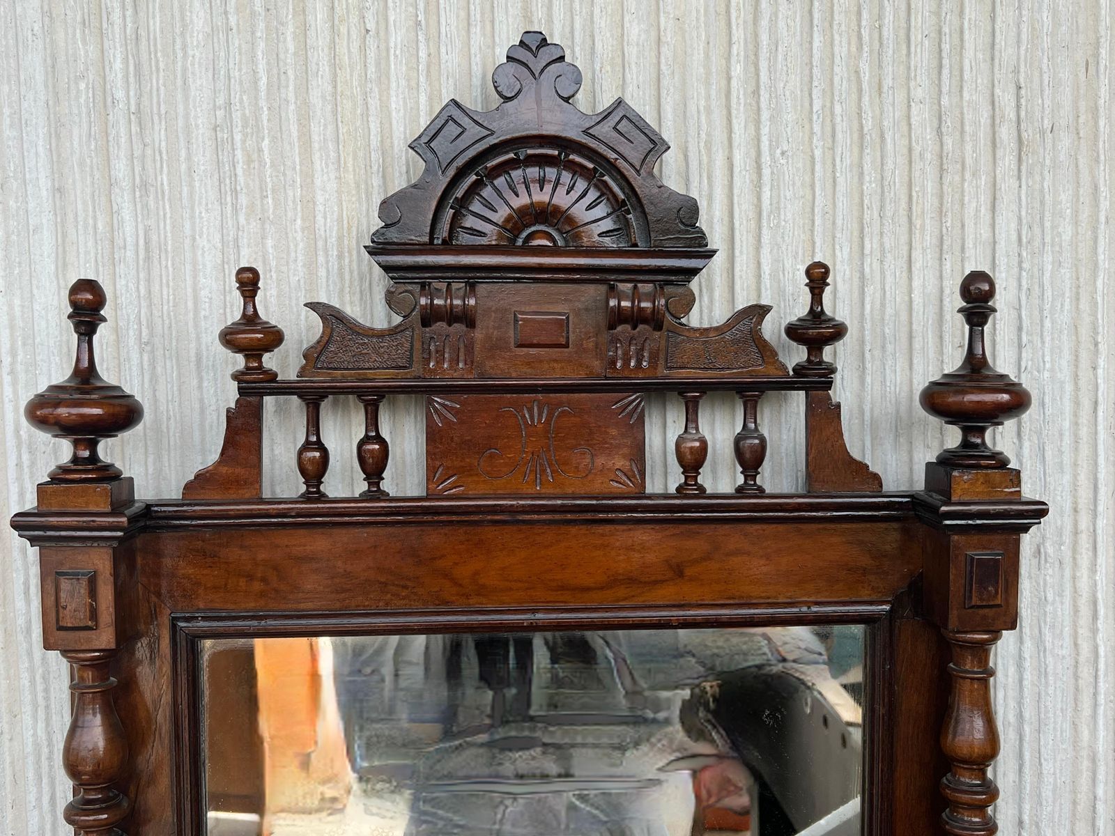 Early 20th French Ebonized Mirror With Turned Columns And High Carved Details photo for sale