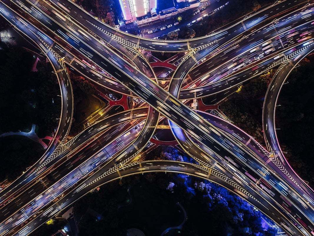 "Top View Of Overpass And Road Intersection At Rush Hour" By Aerialperspective Images