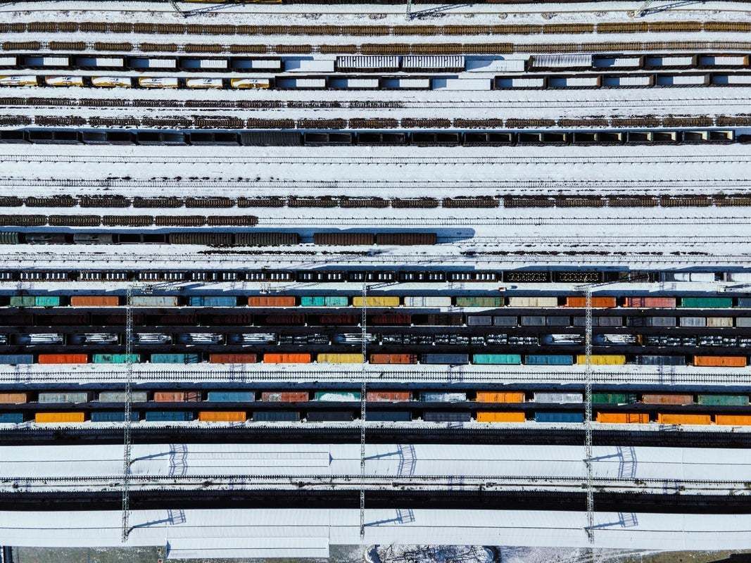 "Drone Point View Of Freight Trains And Railway Station In Winter" By Aerialperspective Images