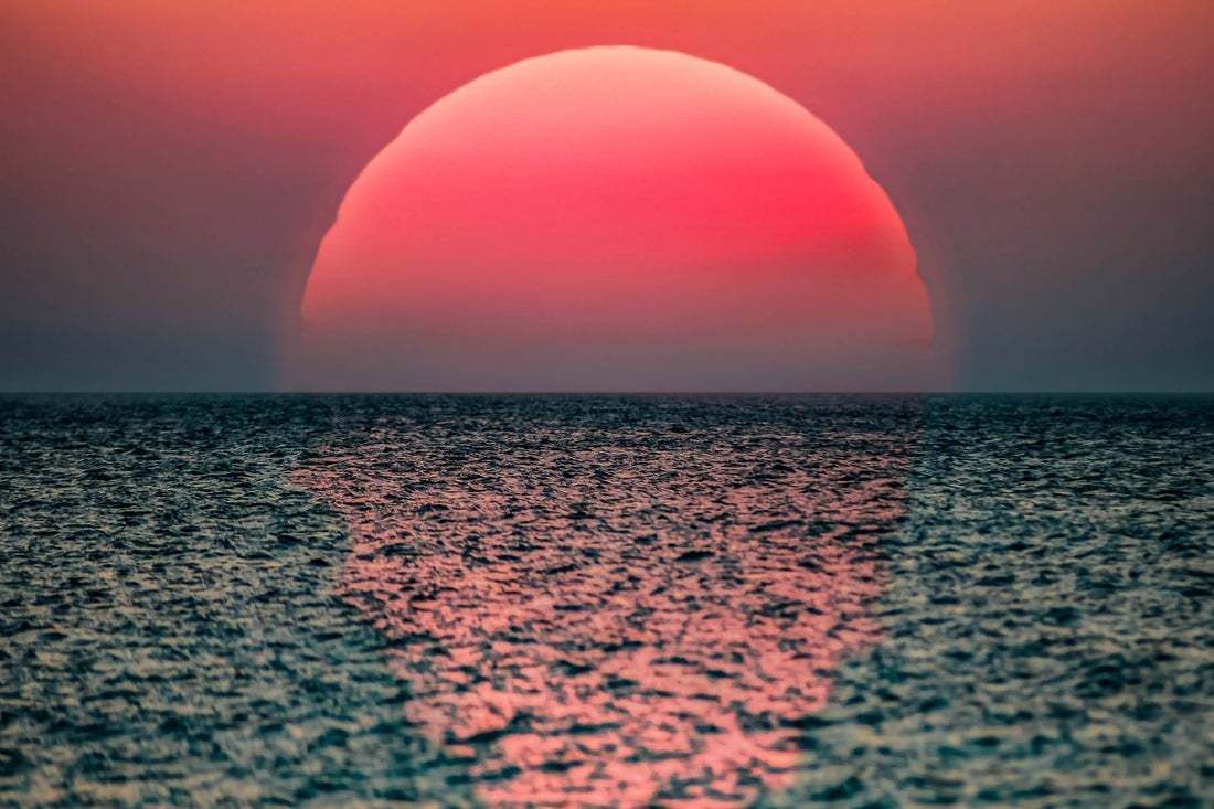 "Idyllic Sunrise With Huge Sun Rising Over The Sea" By Artur Debat